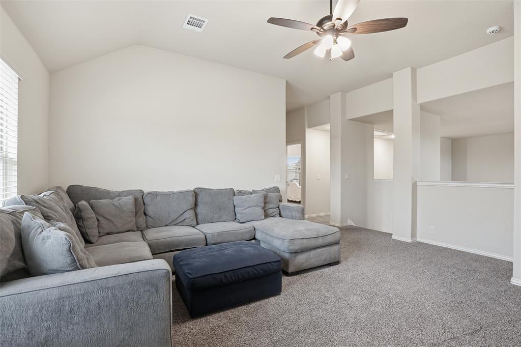 4002 Grove Valley Road Midlothian, TX 76065 - Photo 27 of 40 a living room with furniture and a chandelier