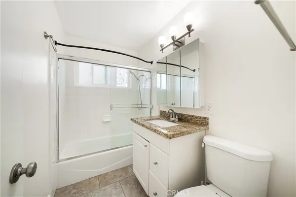 a front view of a building with a yard