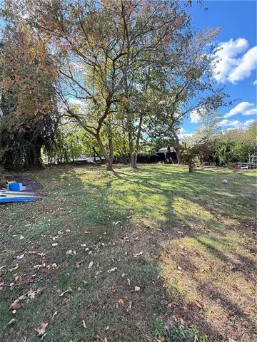 a view of a field with trees