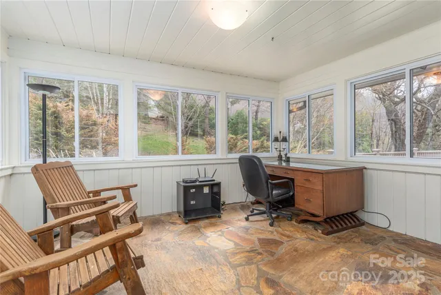 a workspace with furniture and a window