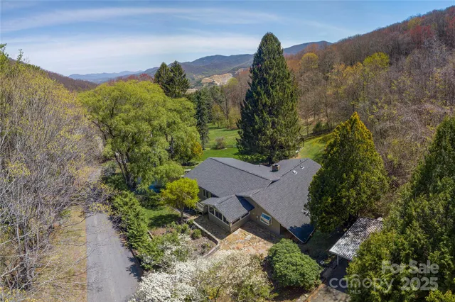 an aerial view of a house with a garden