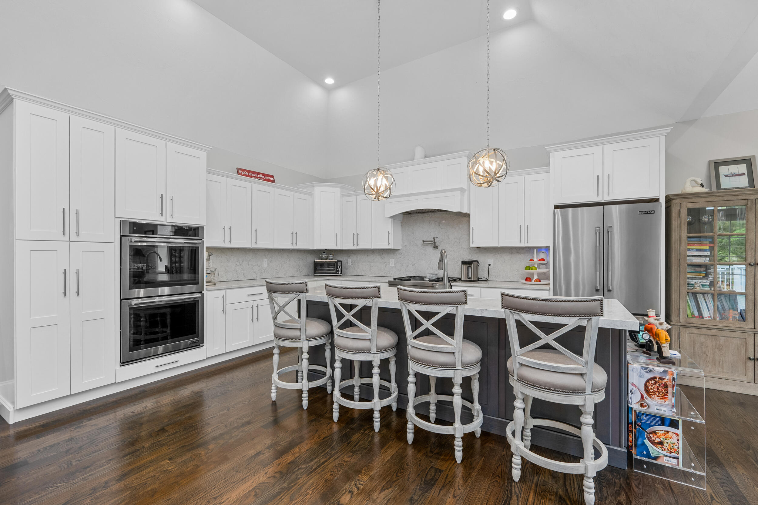 22 Camden Lane Mashpee, MA 02649 - Photo 14 of 46 a kitchen with stainless steel appliances a stove a microwave and a refrigerator