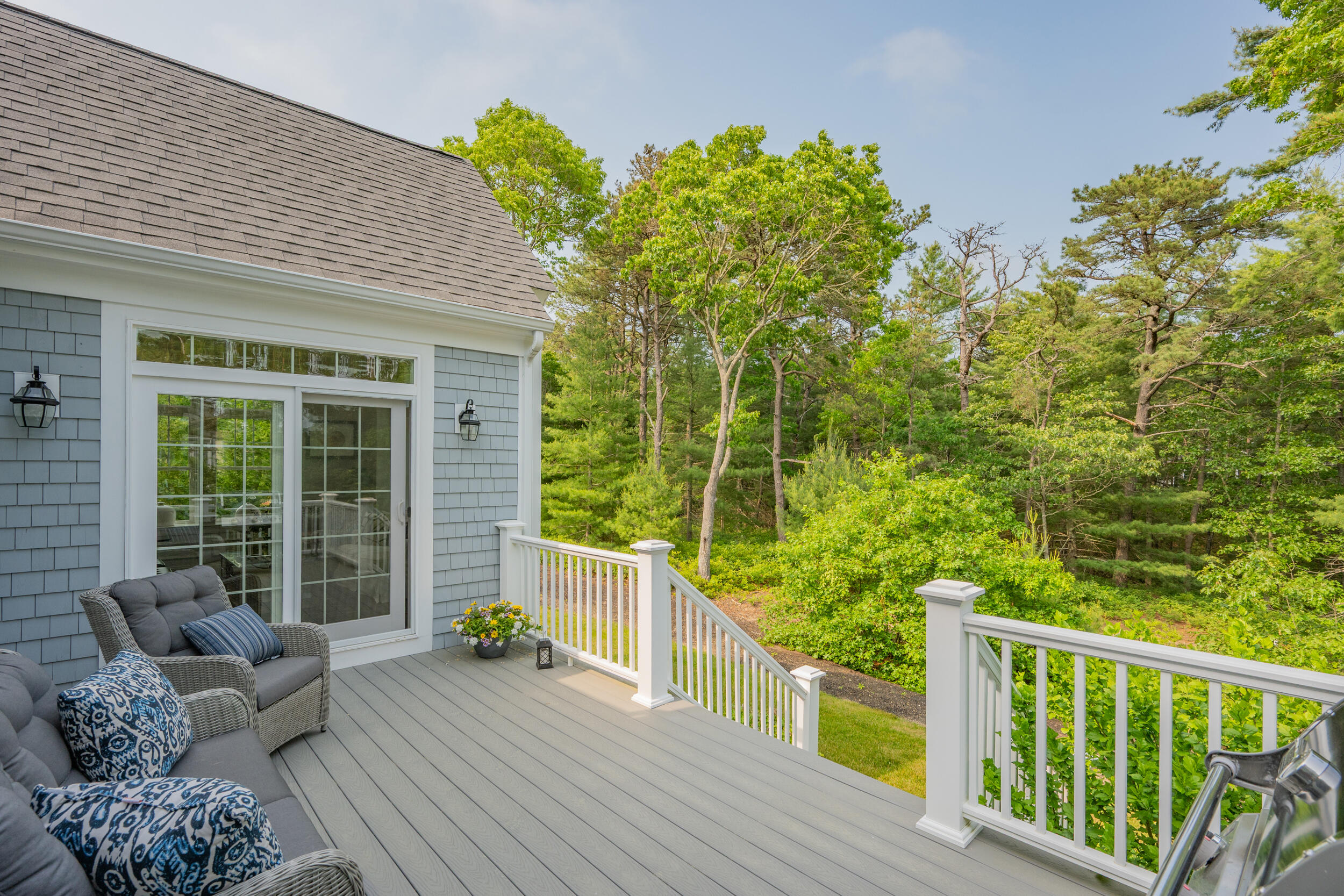 22 Camden Lane Mashpee, MA 02649 - Photo 39 of 46 a porch with seating space and trees in the background