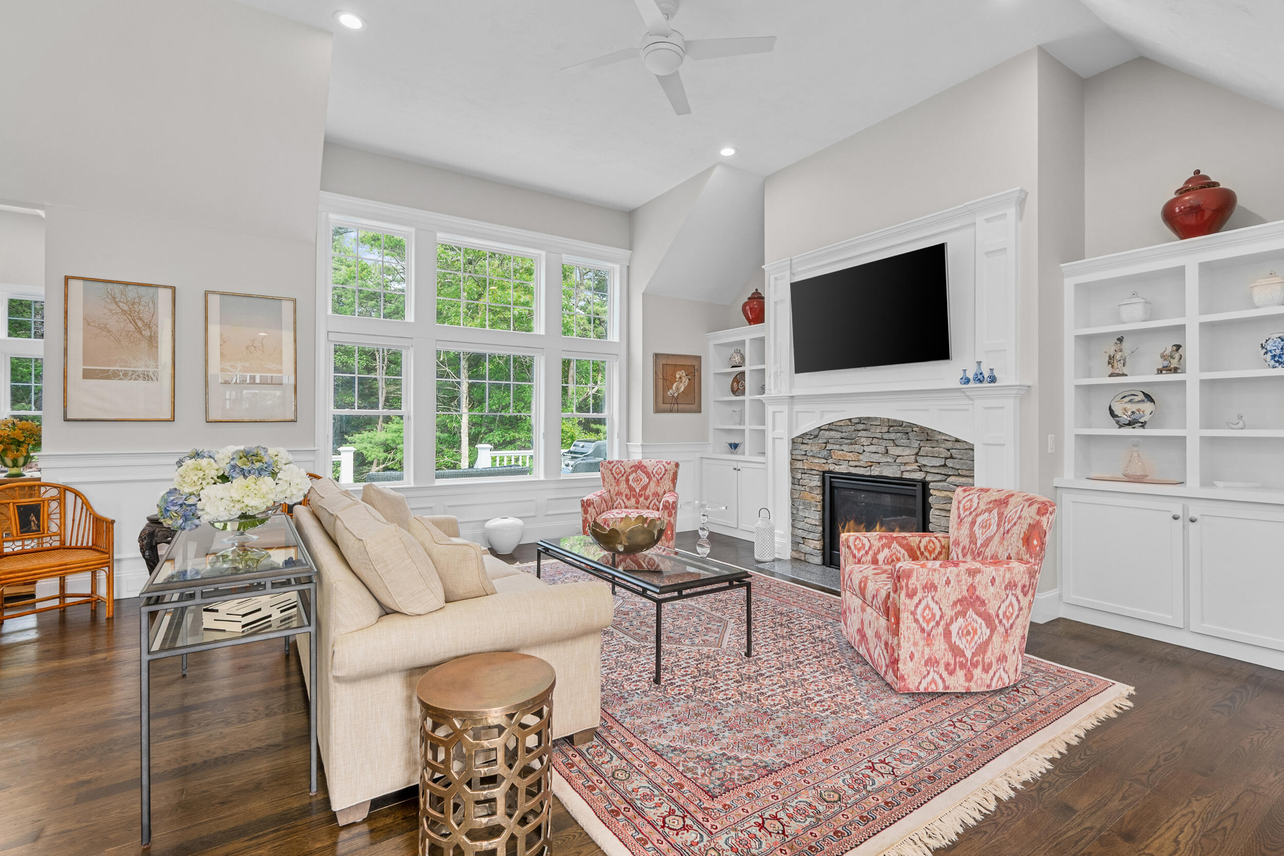 22 Camden Lane Mashpee, MA 02649 - Photo 9 of 46 a living room with furniture a flat screen tv and a fireplace