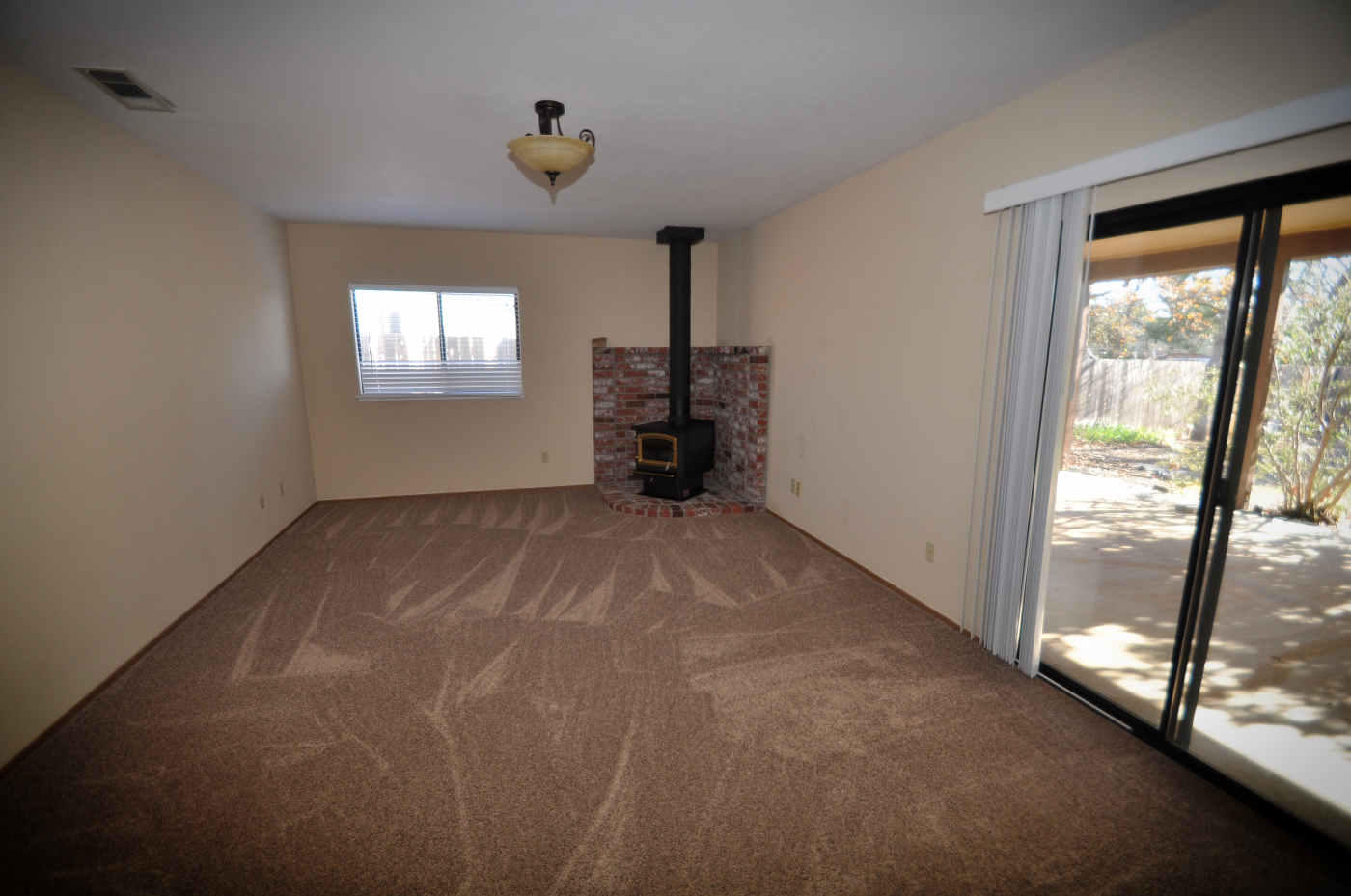2867 Camulos Way Redding, CA 96002 - Photo 3 of 13 a view of a livingroom with an empty space and a window