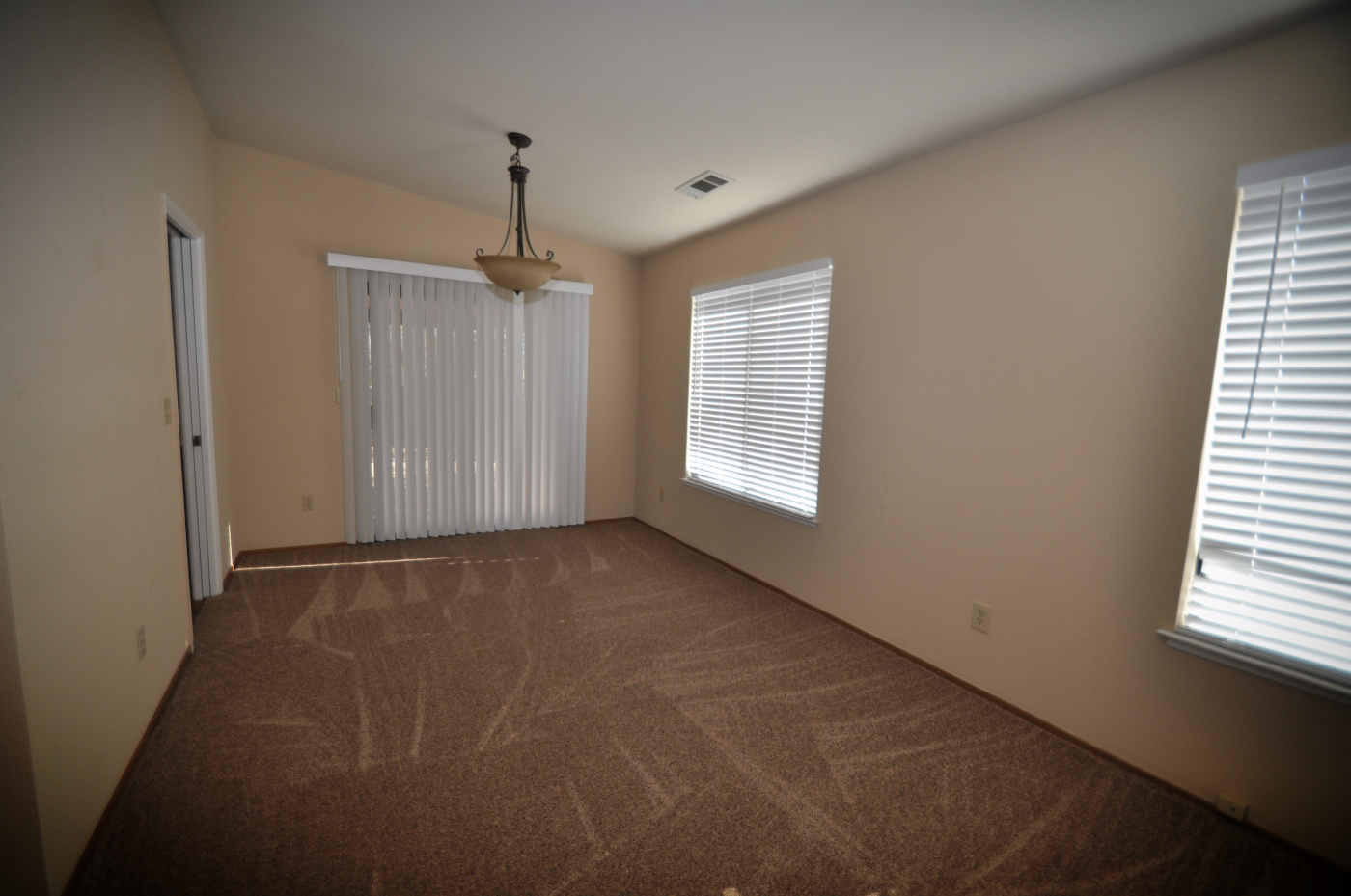 2867 Camulos Way Redding, CA 96002 - Photo 6 of 13 a view of an empty room with a window