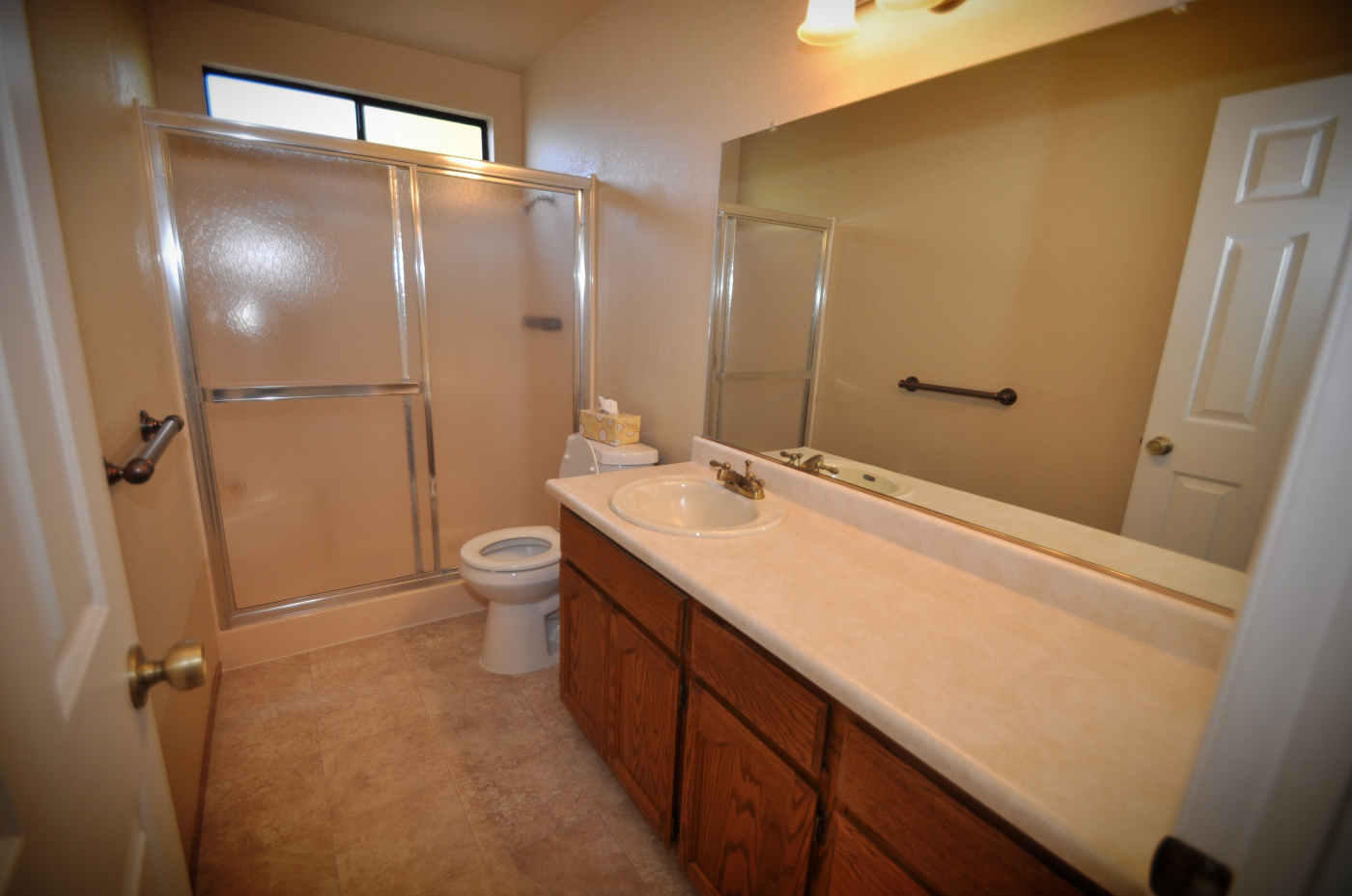 2867 Camulos Way Redding, CA 96002 - Photo 7 of 13 a bathroom with a double vanity sink toilet and shower