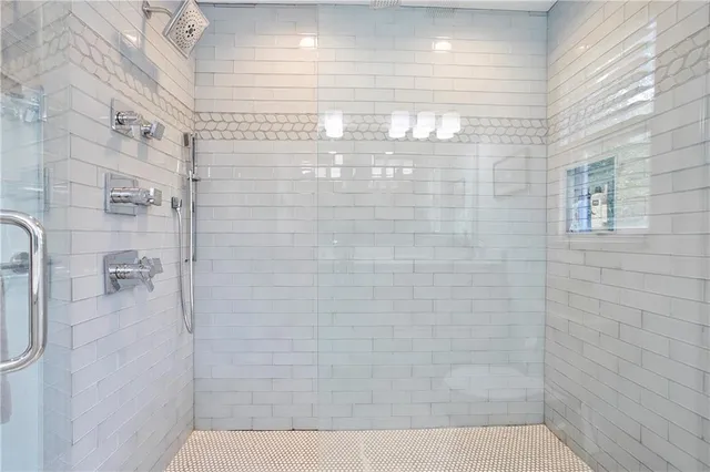 a view of a patio with table and chairs potted plants with wooden floor and fence