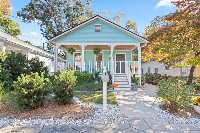 a balcony with table and chairs