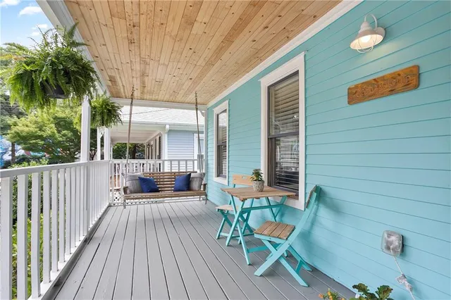 a kitchen with kitchen island granite countertop a sink cabinets and stainless steel appliances