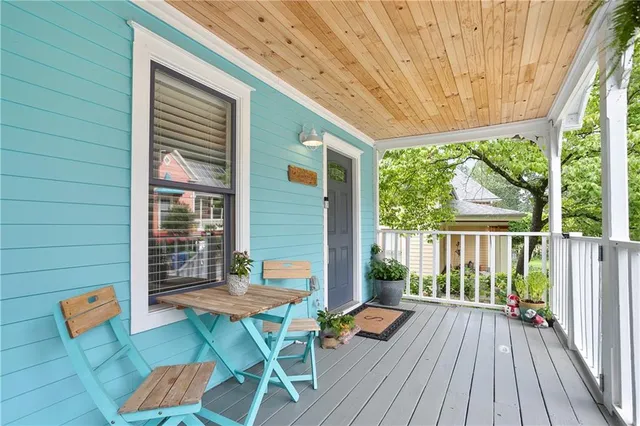 a kitchen with a sink and wooden floor