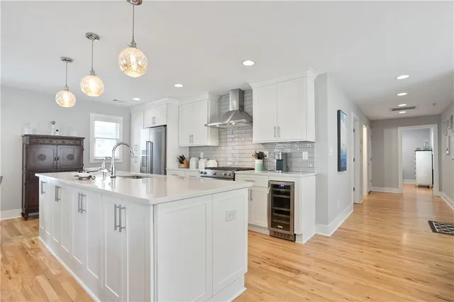 a living room with furniture and kitchen view