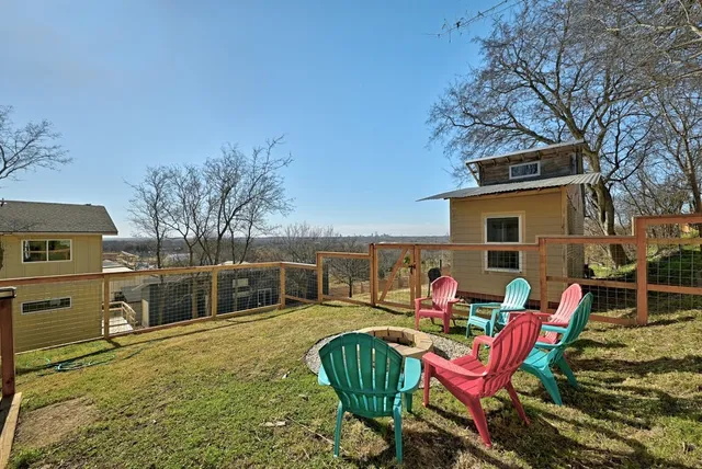 a view of a city with lush green forest