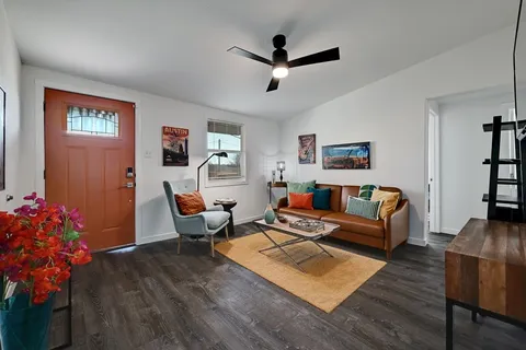 a kitchen with stainless steel appliances white cabinets and a sink