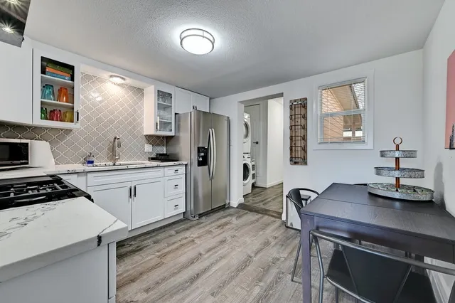 a bedroom with a bed and a ceiling fan
