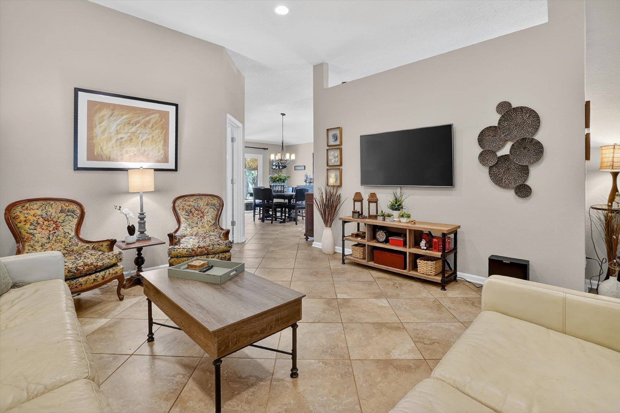 137 Fallen Timber Way St. Augustine, FL 32084 - Photo 11 of 45 Living area with light tile patterned floors and suspended lighting
