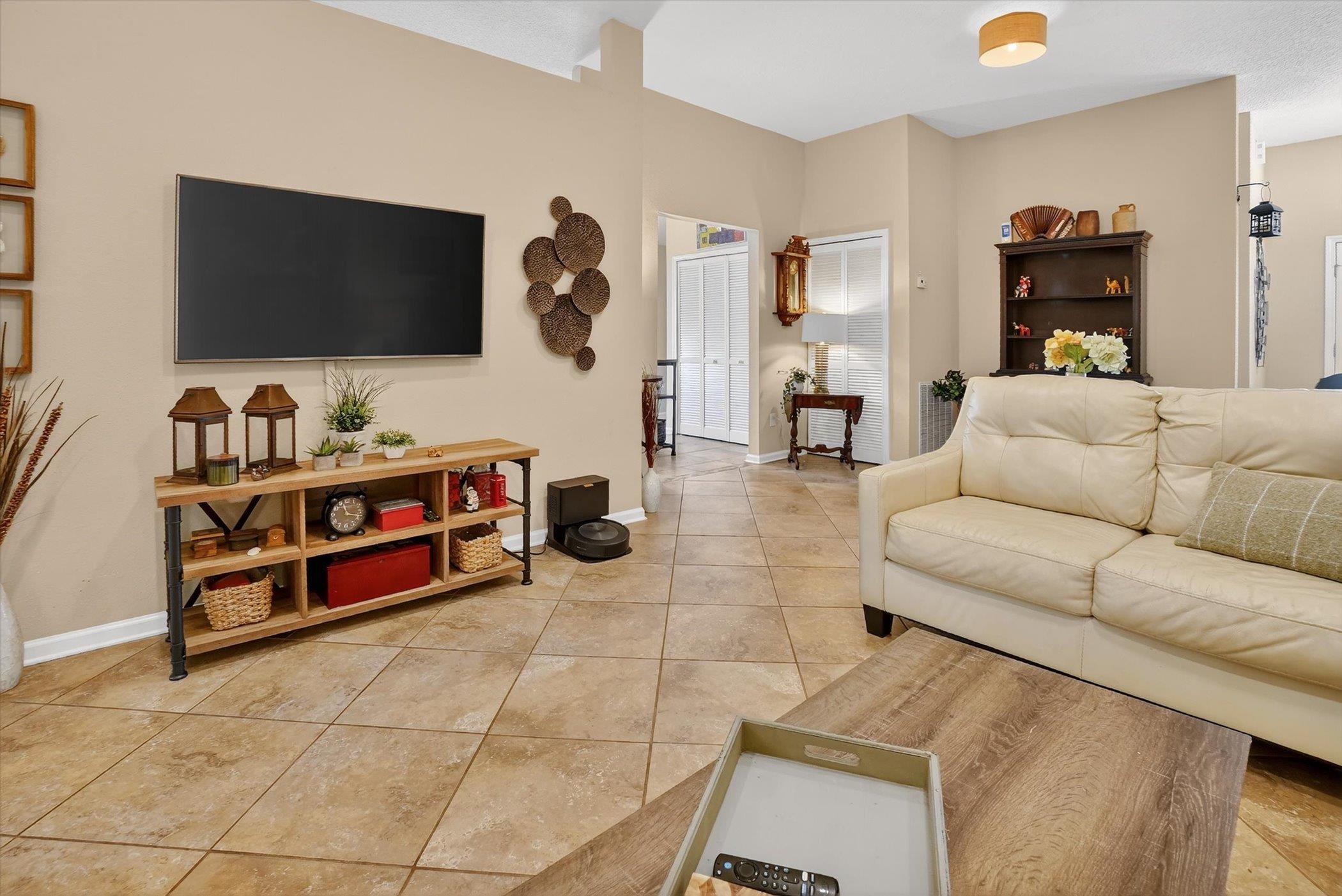137 Fallen Timber Way St. Augustine, FL 32084 - Photo 12 of 45 Living area with light tile patterned flooring and baseboards