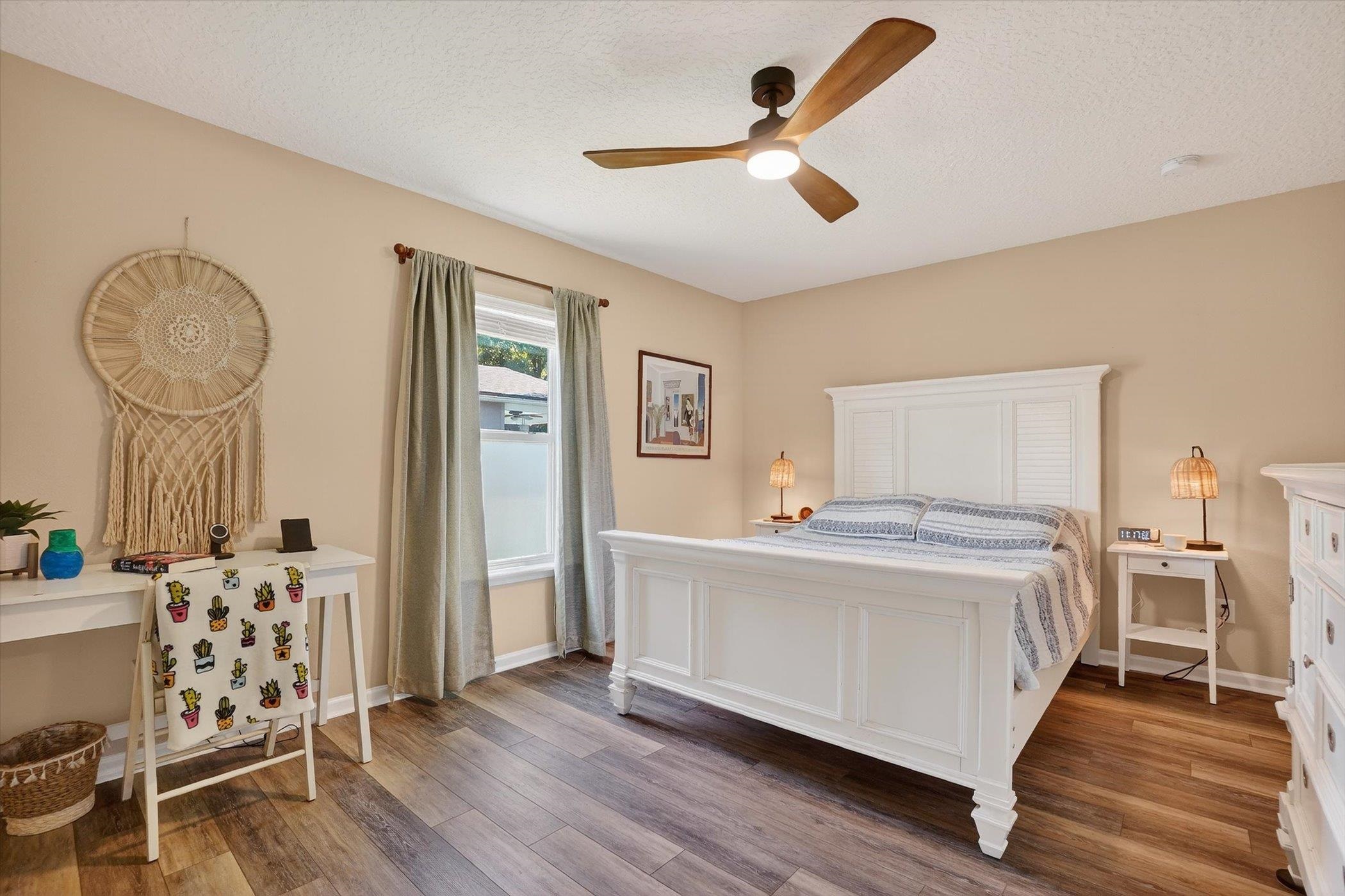 137 Fallen Timber Way St. Augustine, FL 32084 - Photo 26 of 45 Bedroom featuring wood finished floors, a ceiling fan, and a textured ceiling