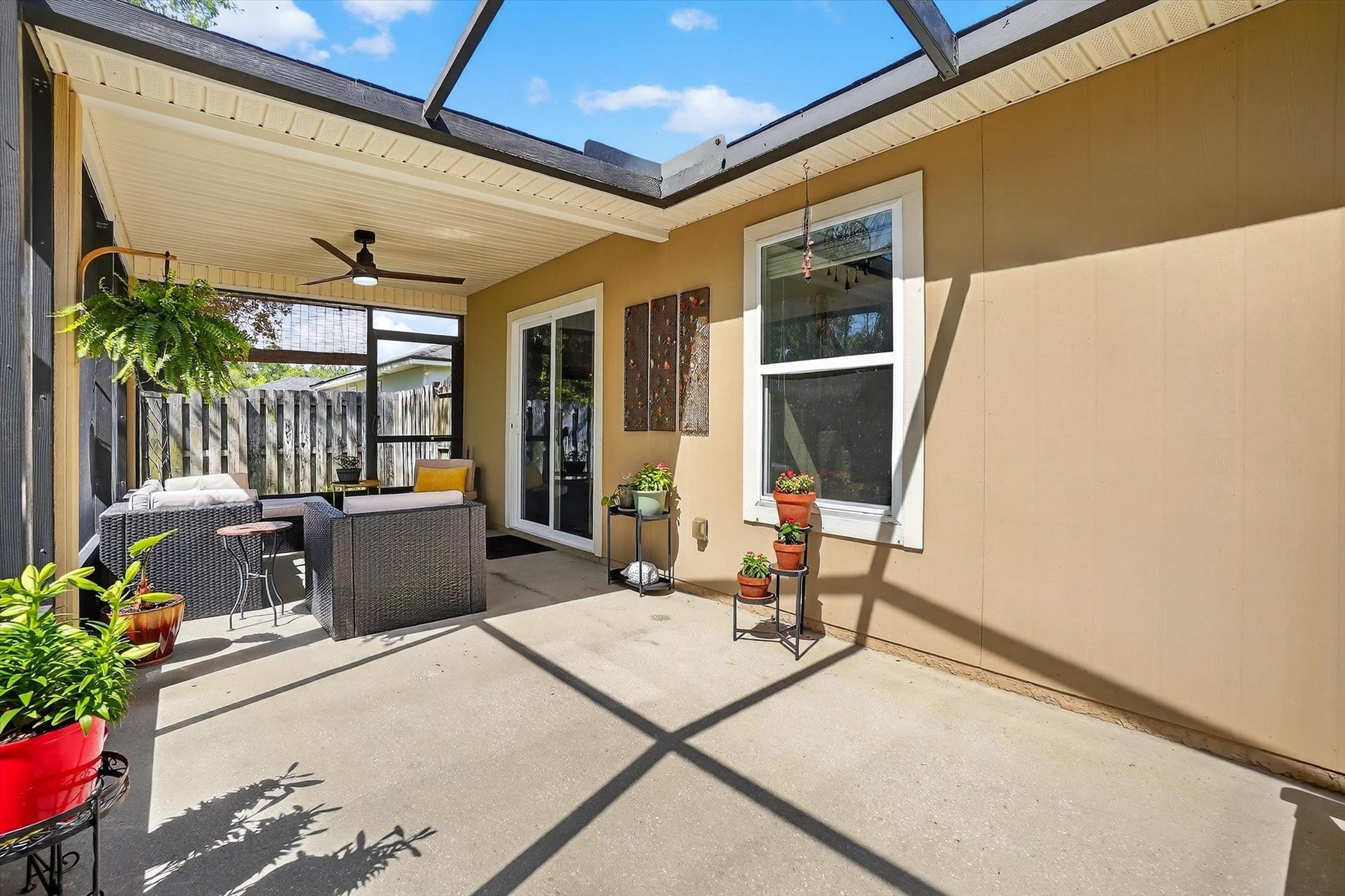137 Fallen Timber Way St. Augustine, FL 32084 - Photo 38 of 45 View of patio featuring an outdoor living space, ceiling fan, a lanai, and a sunroom