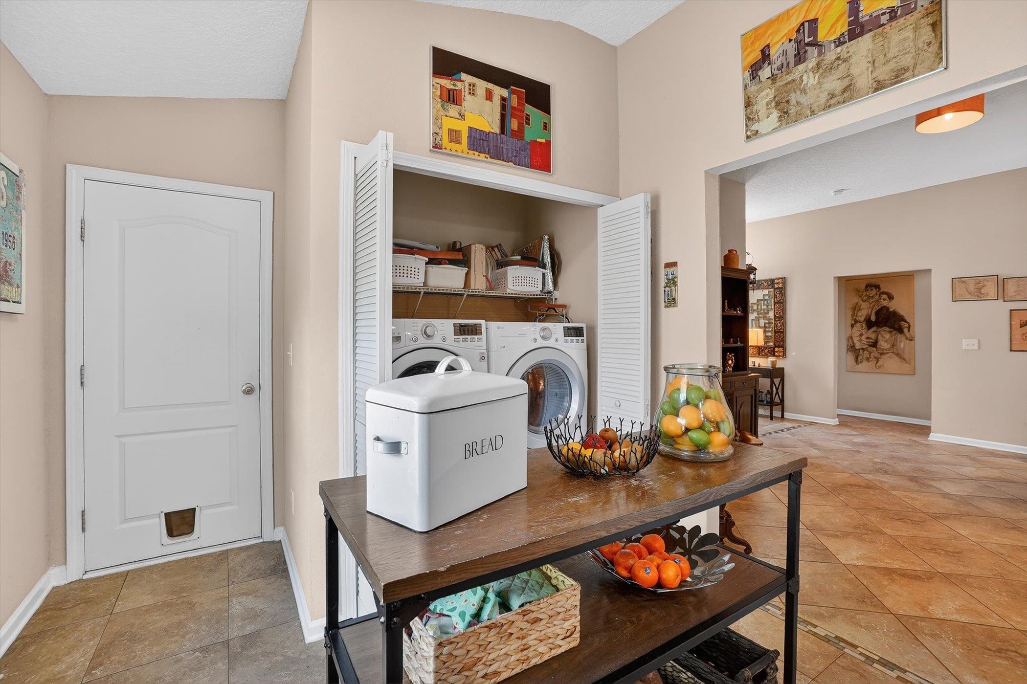 137 Fallen Timber Way St. Augustine, FL 32084 - Photo 43 of 45 Interior space with separate washer and dryer and light tile patterned floors