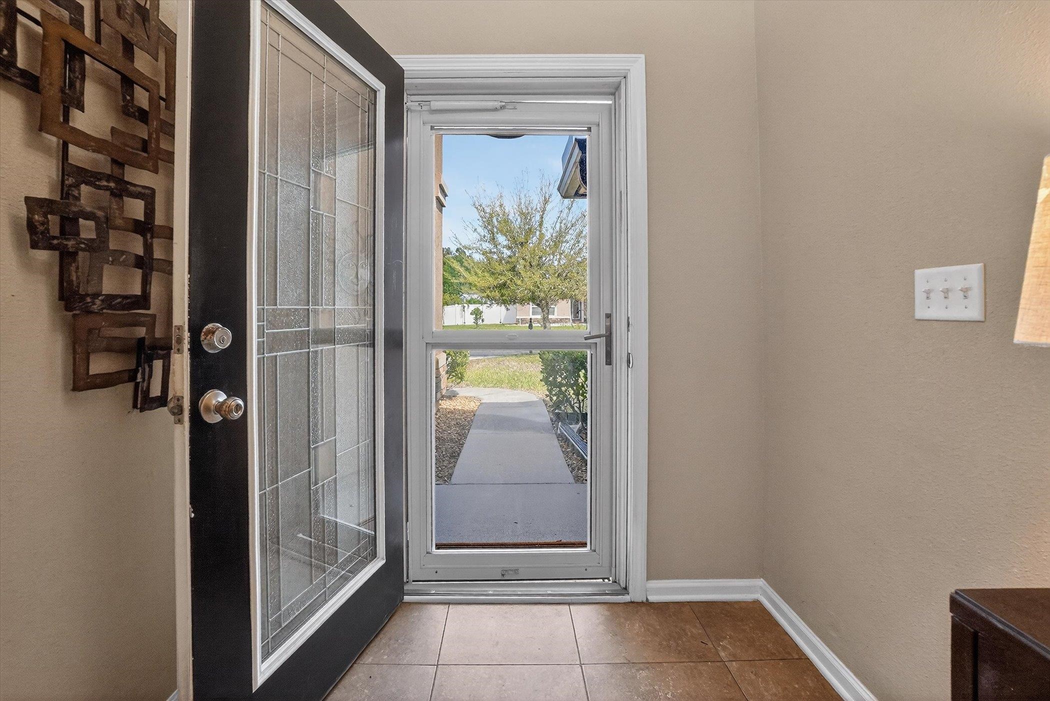 137 Fallen Timber Way St. Augustine, FL 32084 - Photo 7 of 45 Entryway featuring baseboards and tile patterned flooring