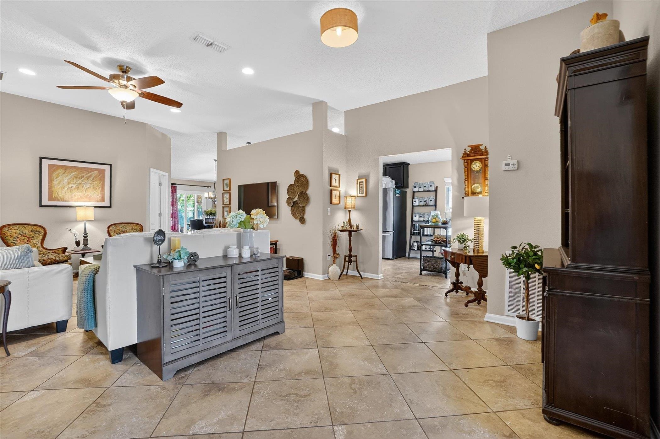 137 Fallen Timber Way St. Augustine, FL 32084 - Photo 9 of 45 Living room with ceiling fan and light tile patterned flooring