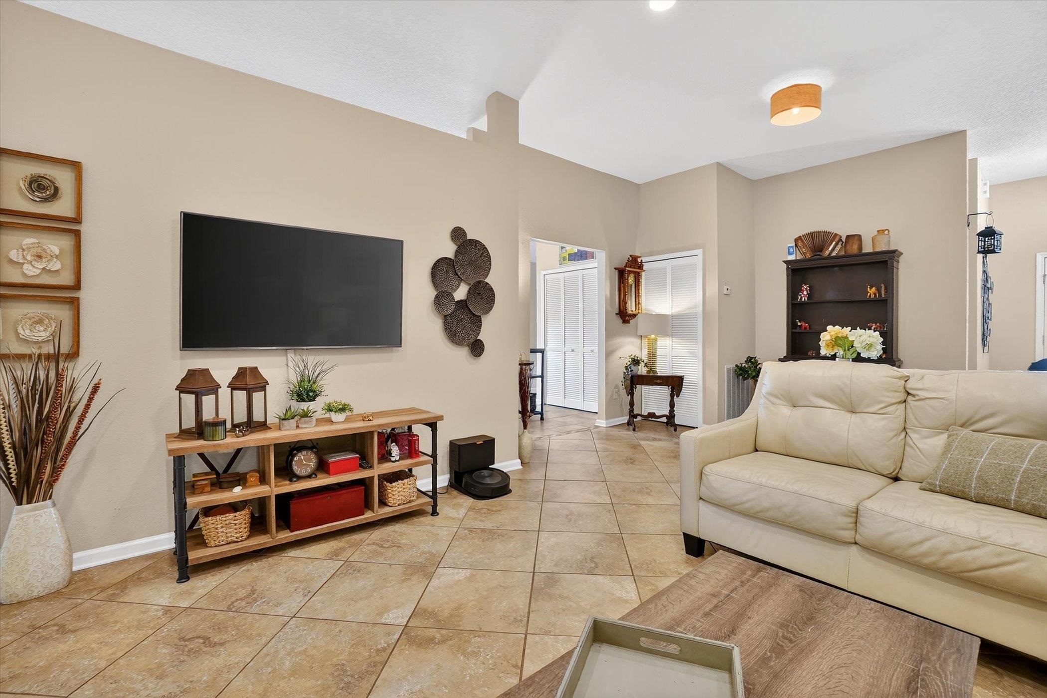 137 Fallen Timber Way St. Augustine, FL 32084 - Photo 10 of 45 Living room with baseboards and light tile patterned floors