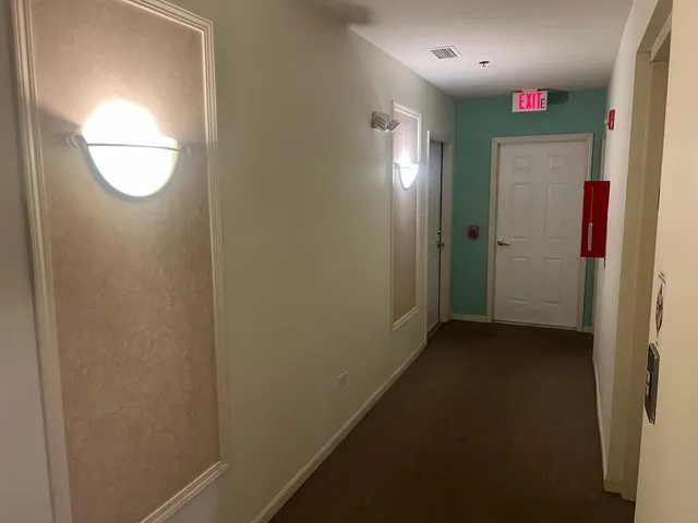 a view of hallway with mirror
