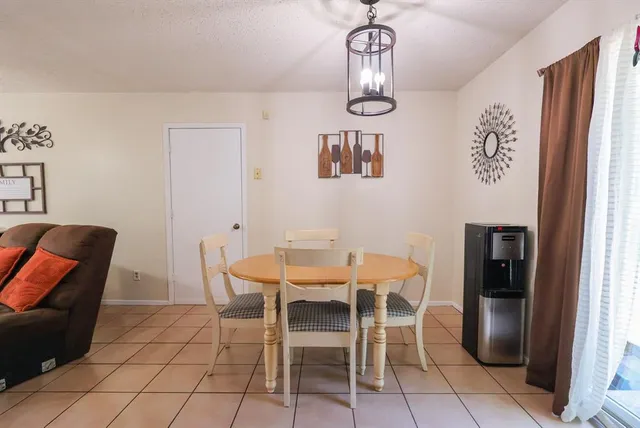 a kitchen with stainless steel appliances granite countertop a refrigerator and a stove