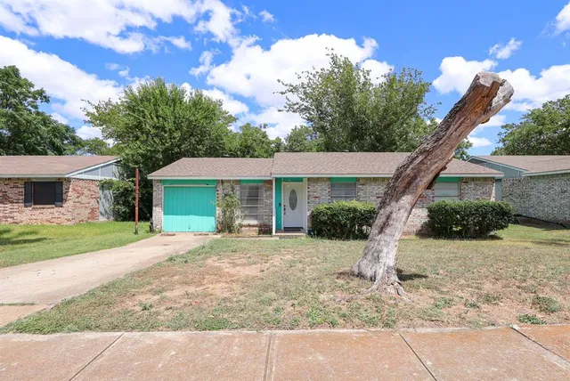 a front view of a house with a yard and porch