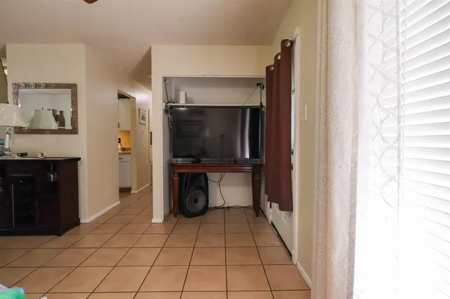 a kitchen with stainless steel appliances a refrigerator and a stove top oven