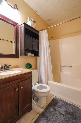 a kitchen with cabinets and stainless steel appliances