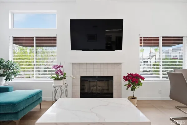 a living room with furniture windows and a fireplace