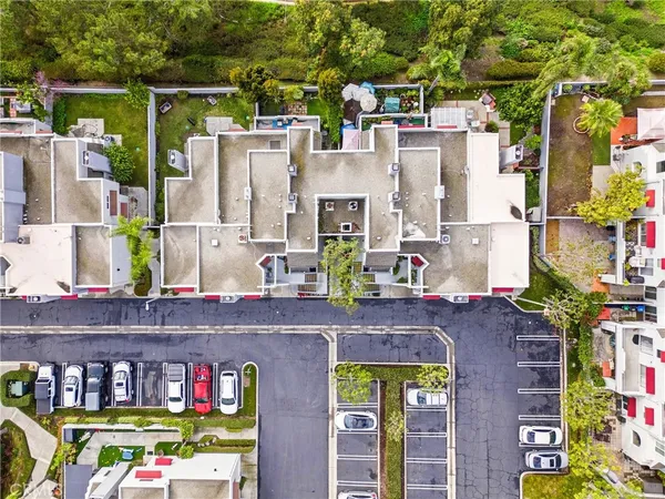 a aerial view of multi story residential apartment building with yard