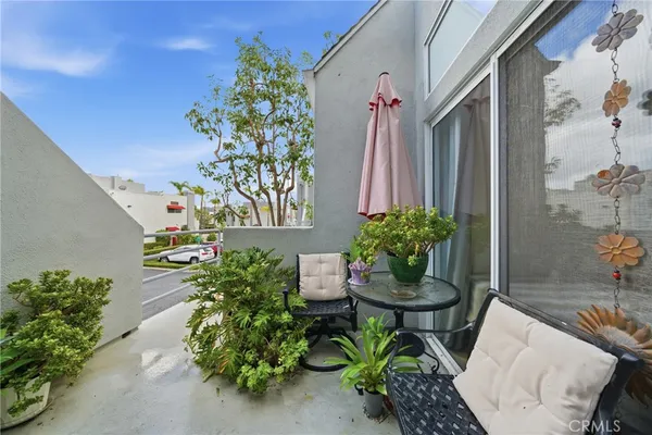 a view of a chairs and table in a backyard