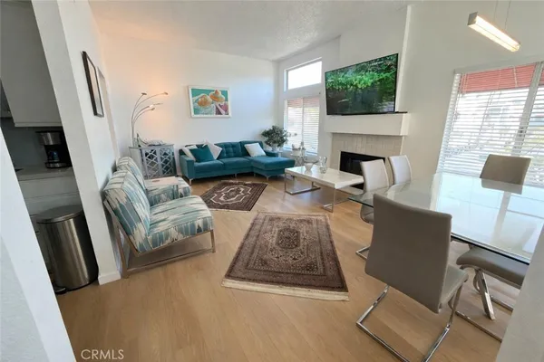 a living room with furniture fireplace and a flat screen tv