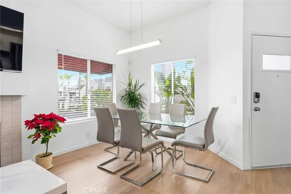 a view of a dining room with furniture window and wooden floor
