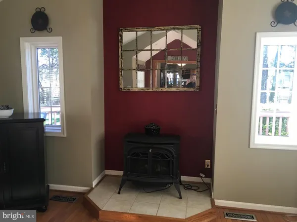 a kitchen with a sink and a mirror