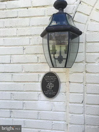 a view of a dining room with furniture and a chandelier