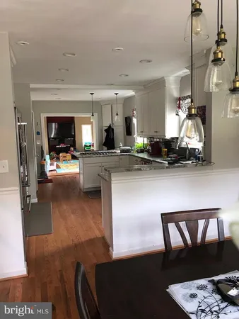 a kitchen with a stove and a sink