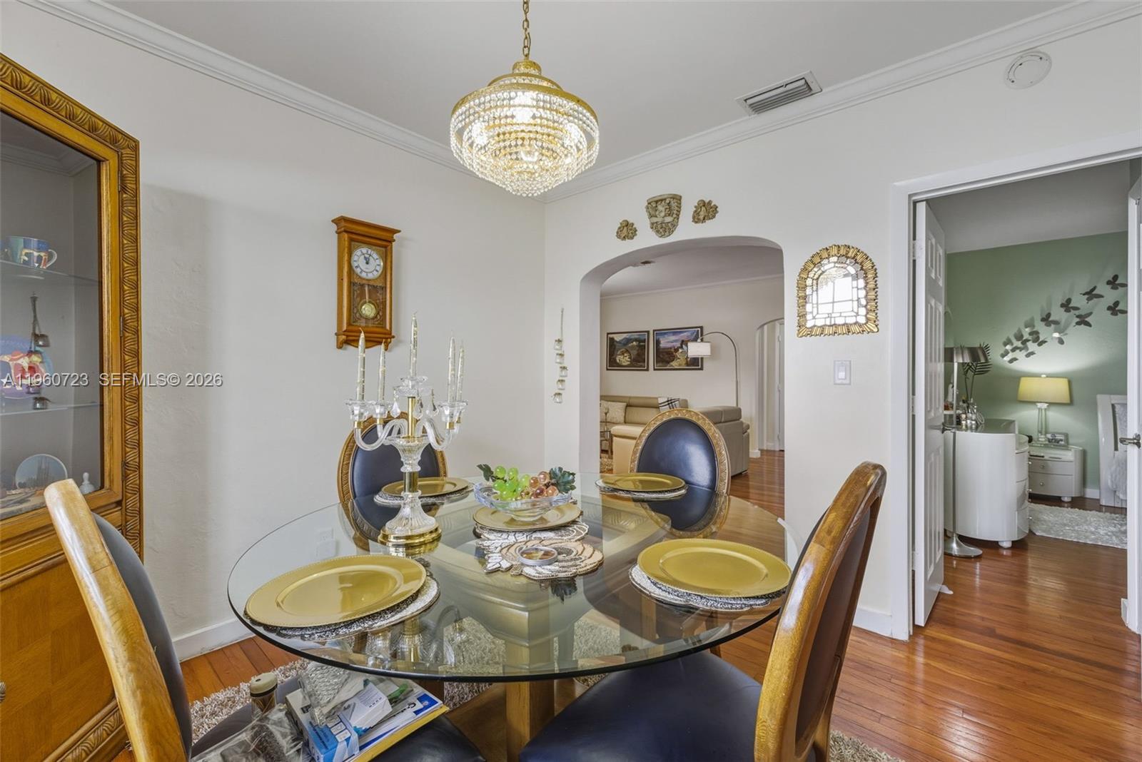 Surfside Surfside, FL 33154 - Photo 13 of 42 a dining room with furniture a chandelier and wooden floor