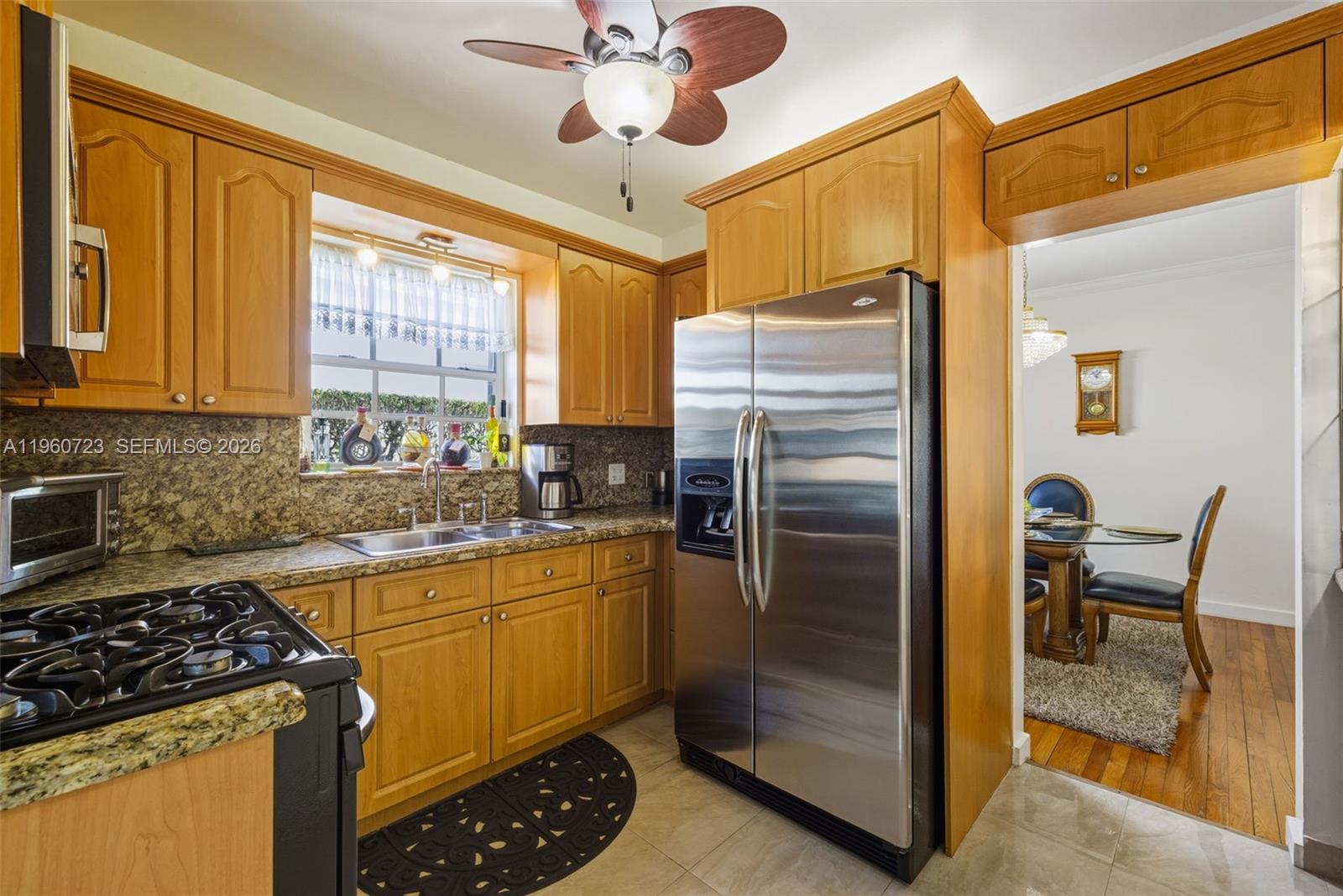 Surfside Surfside, FL 33154 - Photo 16 of 42 a kitchen with a refrigerator a sink and cabinets