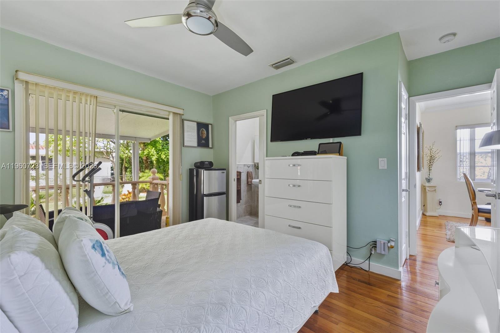 Surfside Surfside, FL 33154 - Photo 20 of 42 a bedroom with a bed and a flat screen tv