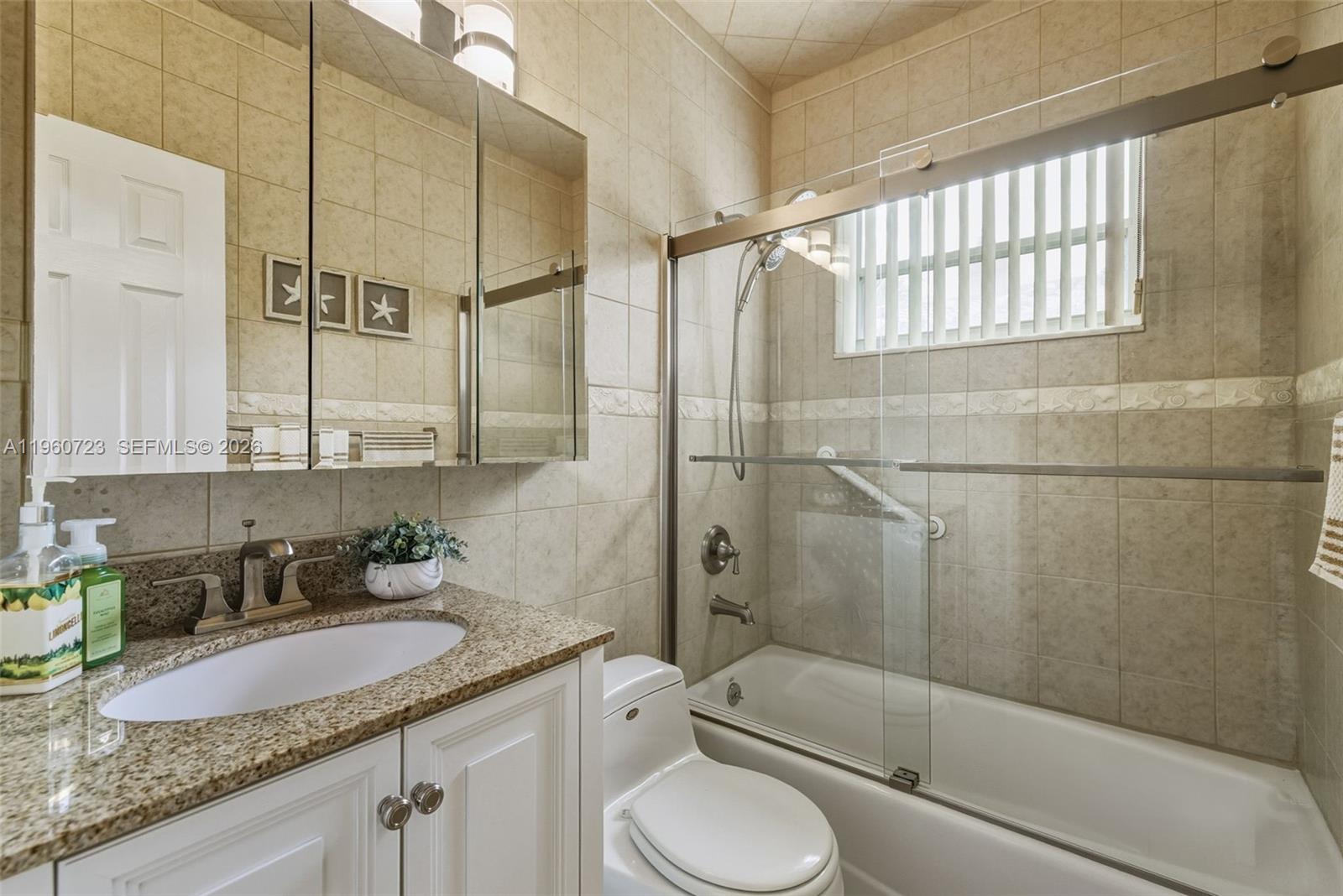 Surfside Surfside, FL 33154 - Photo 24 of 42 a bathroom with a granite countertop sink toilet and shower