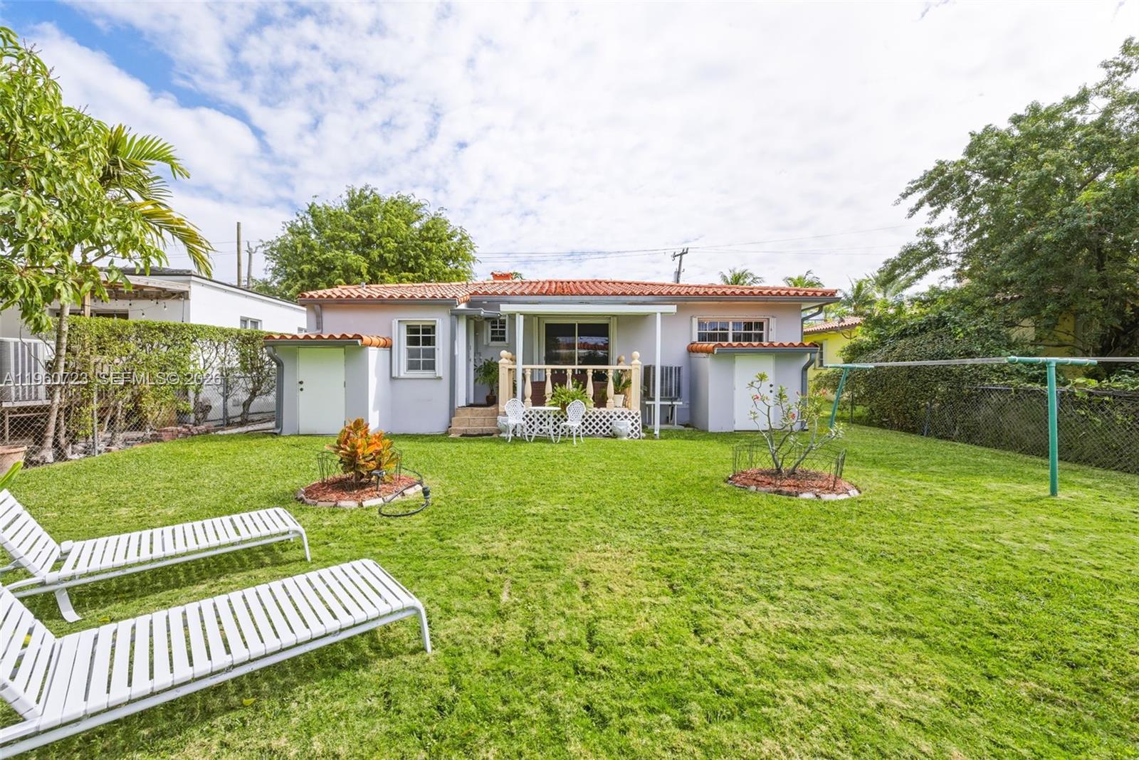 Surfside Surfside, FL 33154 - Photo 32 of 42 a view of a house with a yard and sitting area