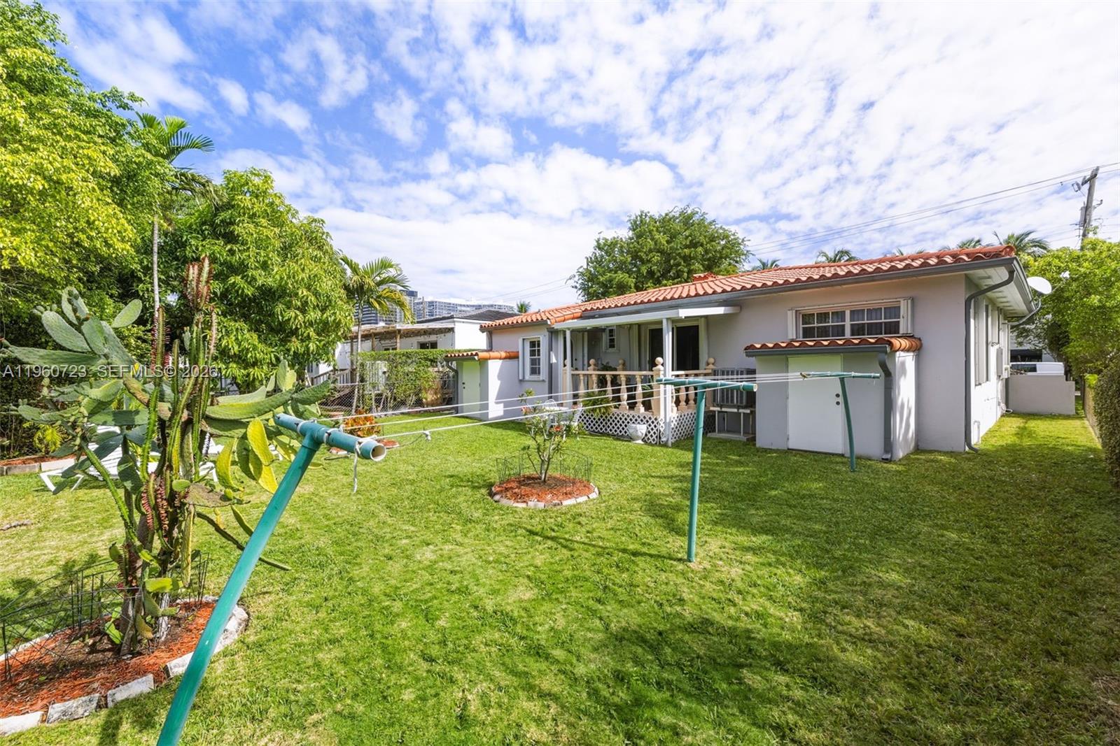 Surfside Surfside, FL 33154 - Photo 33 of 42 a view of a house with backyard and a tree