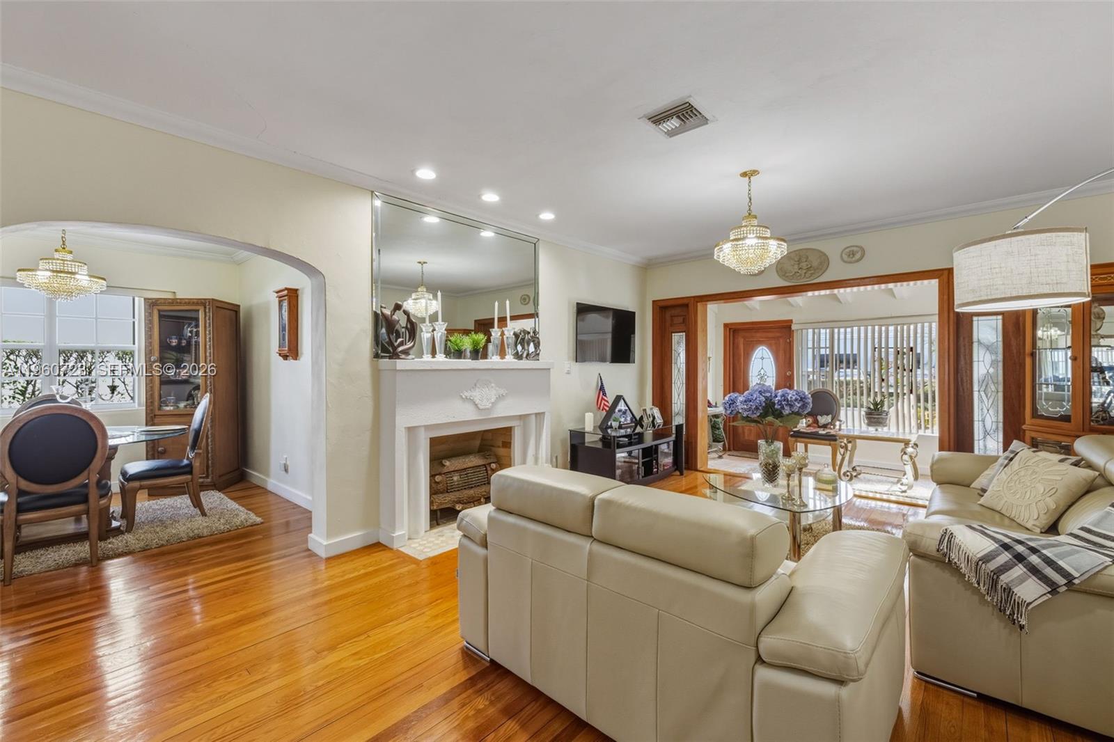 Surfside Surfside, FL 33154 - Photo 9 of 42 a living room with furniture a fireplace and a floor to ceiling window