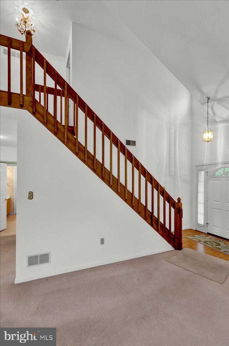 101 Heather Lane Reading, PA 19610 - Photo 12 of 38 a view of staircase with lots of frames on wall and a window
