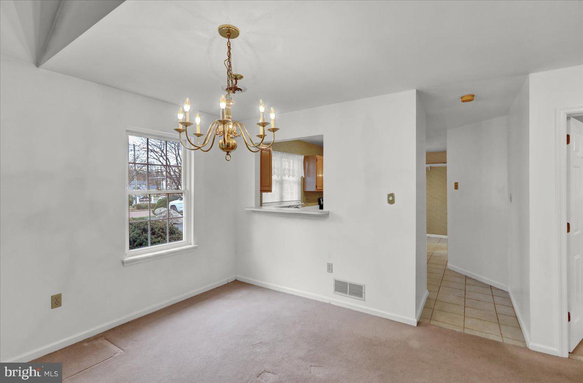 101 Heather Lane Reading, PA 19610 - Photo 13 of 38 a view of a hallway with windows and chandelier