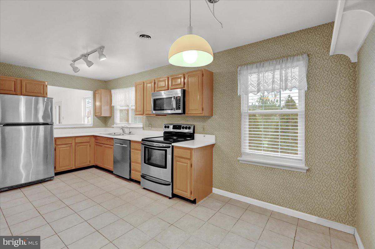 101 Heather Lane Reading, PA 19610 - Photo 17 of 38 a kitchen with cabinets and window